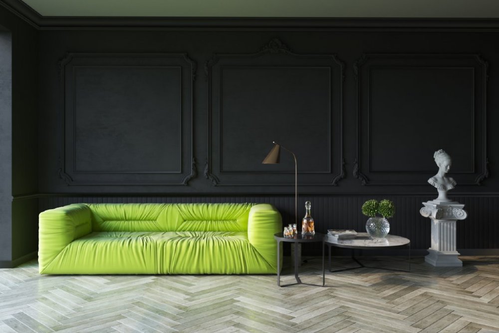 كنب مودرن بلون أخضر براق على أرضية خشبية عصرية وتصاميم جبسية للجدران