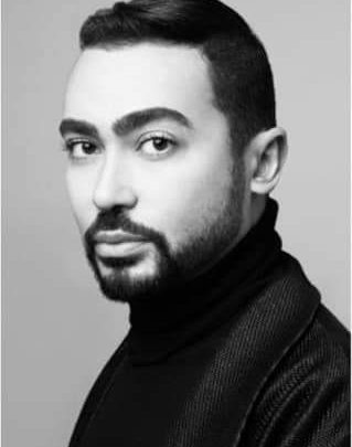 ‏مصمم الأزياء محمد آشي